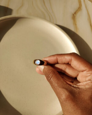 Gold polished silver Moonstone ring with rainbow lighting